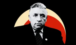 Portret mężczyzny w garniturze, z tyłu kolorowe łuki. Człowiek istota pełna sprzeczności, jego spojrzenie zdaje się to odzwierciedlać.