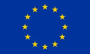 Flaga Unii Europejskiej, symbol jedności i pluralizmu, z dwunastoma złotymi gwiazdami na niebieskim tle.