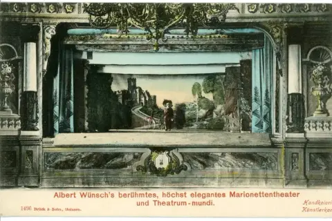 Scena teatru lalek Alberta Wünscha, eleganckie theatrum mundi z zamkiem i postacią.