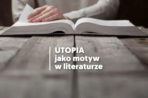 Otwarta księga na drewnianym stole, symbolizująca utopijny i realny obraz rzeczywistości w literaturze.