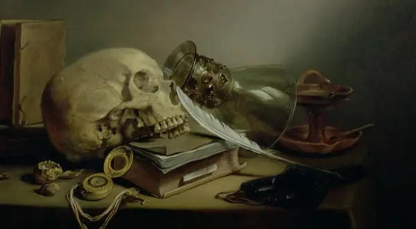 Czaszka, pióro, księga i zegarek – klasyczne symbole vanitas, przypominające o przemijaniu.