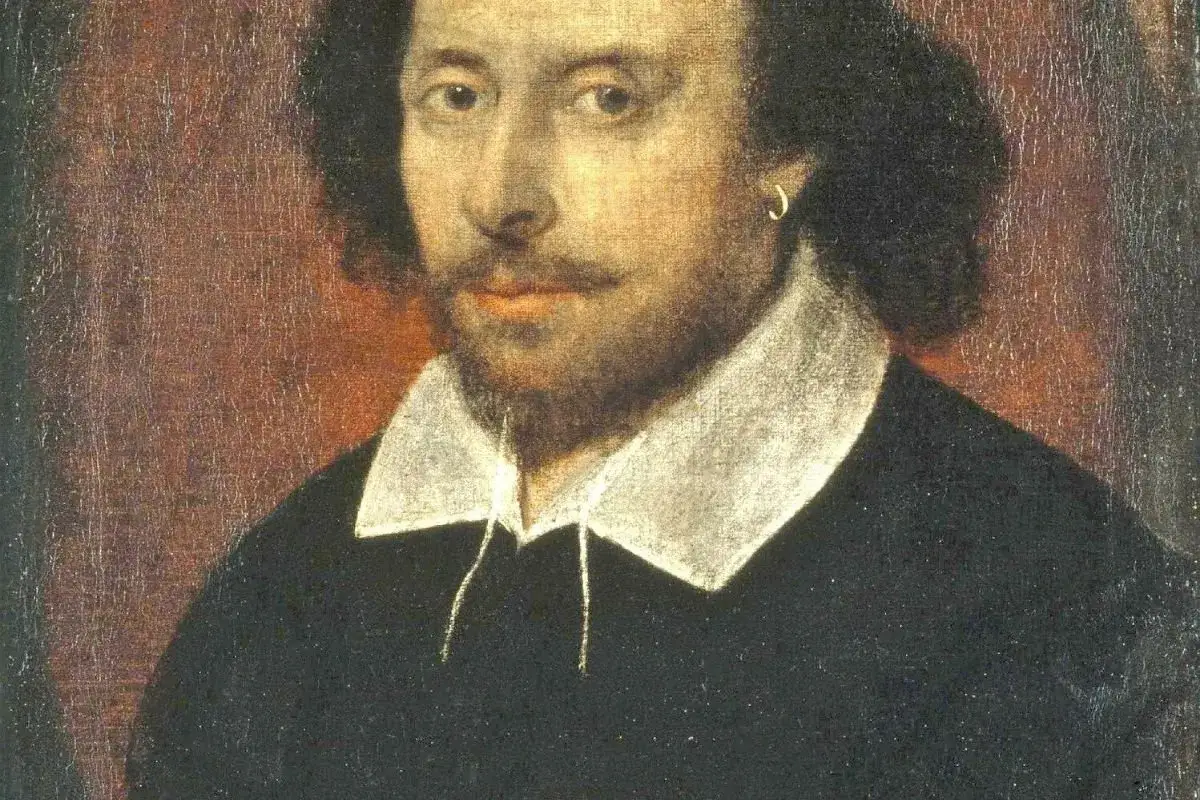 Portret Williama Szekspira, autora Romea i Julii, w czarnym stroju z białym kołnierzem.