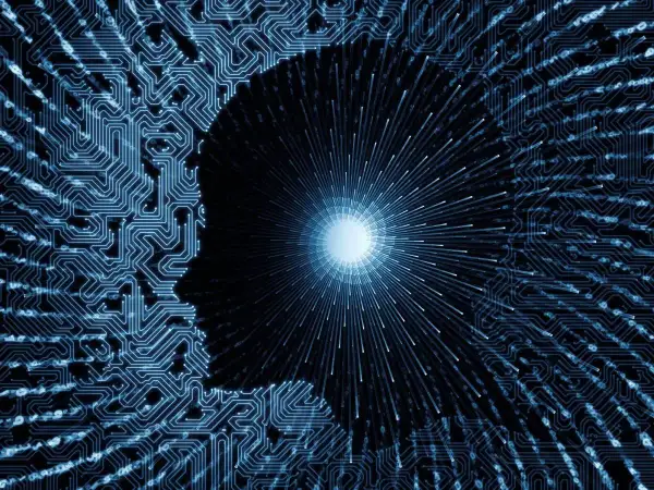 Sylwetka ludzkiej głowy z obwodami drukowanymi, symbolizująca nowy paradygmat myślenia i rozwoju technologicznego.