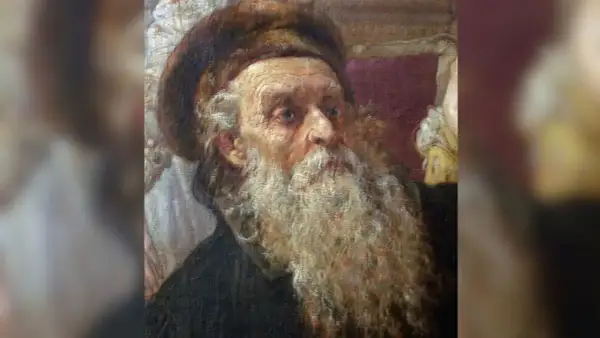 Portret starszego mężczyzny z długą, siwą brodą i futrzaną czapką.