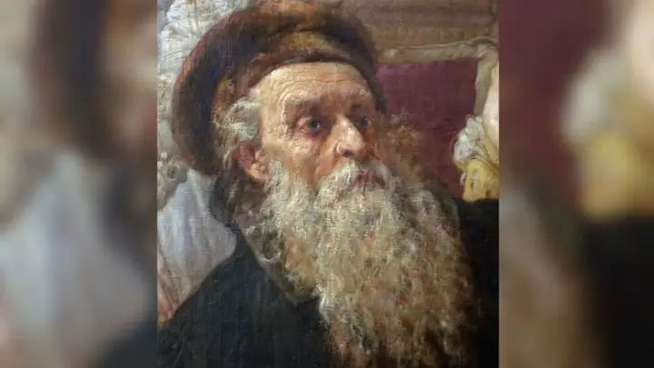 Portret starszego mężczyzny z długą, siwą brodą i futrzaną czapką.